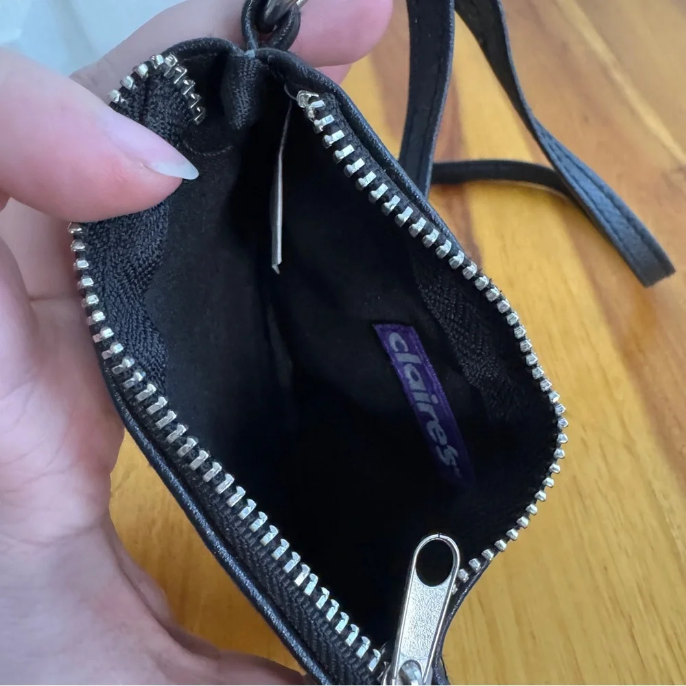 Claire’s‎ black faux leather eyes lashes crossbody